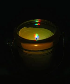 Harris Shutter effect small scented candle flame Stock Photos