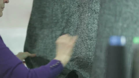 Harris tweed fabric being checked for quality Stock Footage 58495111