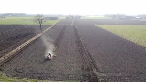 Harrowing the soil with old caterpillar tractor Видео 149223314