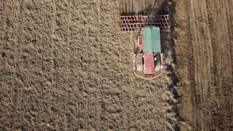 Harrowing the soil with old caterpillar tractor Stock Footage 149226513