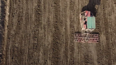 Harrowing the soil with old caterpillar tractor Stock Footage 149246714
