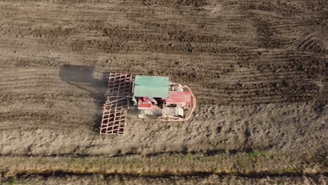 Harrowing the soil with old caterpillar tractor Stock-Footage 149258073
