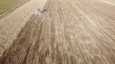Harrowing the soil with old caterpillar tractor Stock-Footage 149262177