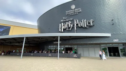 Harry Potter Warner Bros. Studio Tour London building with visitors Stock Footage 322922486