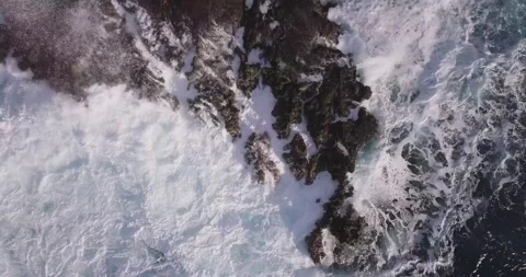 Harsh and aggressive waves crashing violently over sea stacks in oahu west Stock Footage 232480317