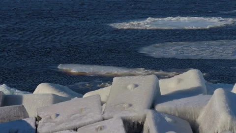 Harsh freezing temperatures envelop angular concrete structures beside Stock Footage 328377658