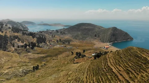 Harsh hilly dry landscape of Isla del Sol in Lake Titicaca Stock Footage 124509128