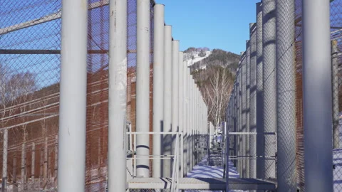Harsh metal structure built from rigid beams and mesh Stockbeeldmateriaal 322041416