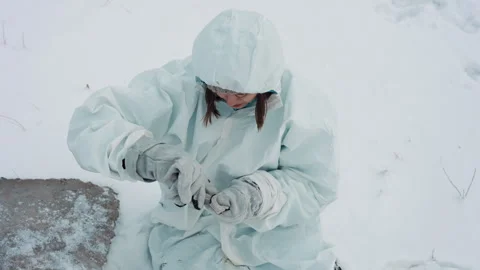 Harsh winter scene with makeshift sensor repair. Focused individual performing Video stock 342744950