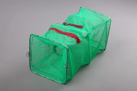 Harvest gear of rectangular shrimp cage for fishing tackle on grey background Stock Photos