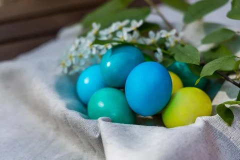 Harvest of Spring: A Cluster of Easter Eggs in a Rustic Basket Stock Photos