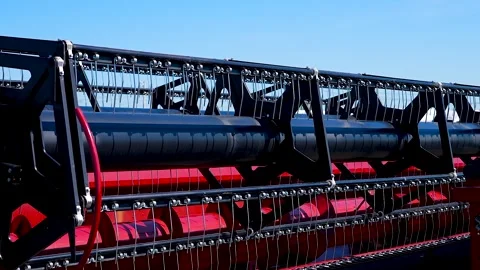 Harvester header details against blue sky. Stock Footage 340896447