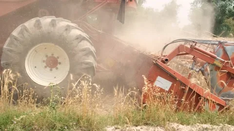 Harvester mower machine cuts wheat. Agricultural harvesting works. the harv.. Stock Footage 246476560