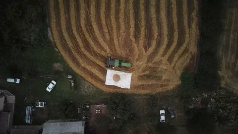 The harvester is preparing to leave after working on a small field Stock Footage 114651620