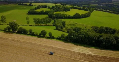 Harvester with tractor on field Video stock 84880608