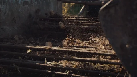 Harvester tractor processing potatoes (slow motion) Stock Footage 115122478
