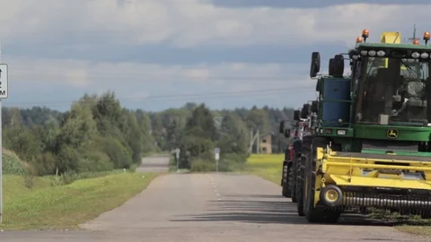 Harvesters on the road Stock Footage 87642466
