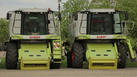 The harvesters standing in the farm complex Stock Footage 73946757