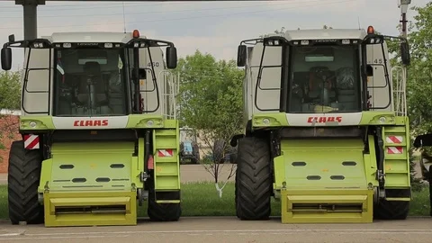 The harvesters standing in the farm complex Stock Footage 73946788