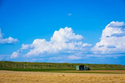 Harvesting on the fields in summertime Stock Photos