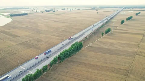 Harvesting of wheat fields by the big river and harvesting of autumn crops. Stock Footage 288163359