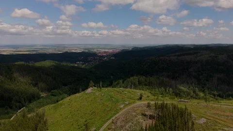 Harz forested hills and Wernigerode in the distance aerial Germany Vídeo Stock 341284035