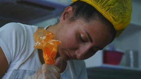 Has a layer of cream on the cake Stock Footage 75538549