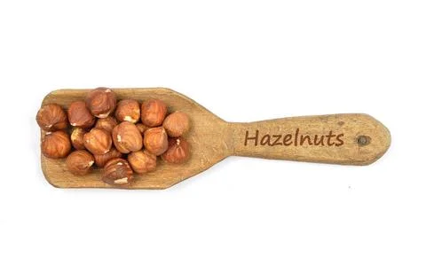 Haselnuesse - Hazelnuts on shovel Haselnuesse - Hazelnuts on shovel Copyri... Stock Photos