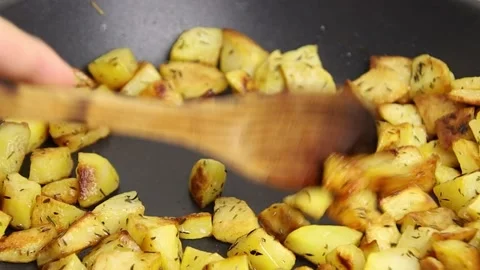 Hash browns cooking in a frying pan Stock Footage 163009610