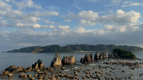 Hashigui Rock with space for copy in the sky, Kushimoto, Wakayama Prefecture Stock Footage 243566256