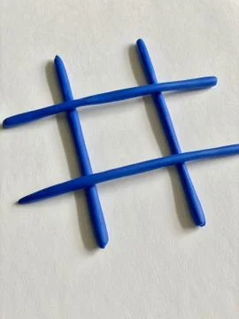 Hashtag or an empty cage for the game of noughts and crosses Stock Photos