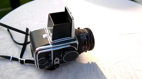The Hasselblad camera is lying on a white table Stock Footage 65421819