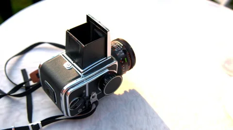 The Hasselblad camera is lying on a white table Stock-Footage 65421830
