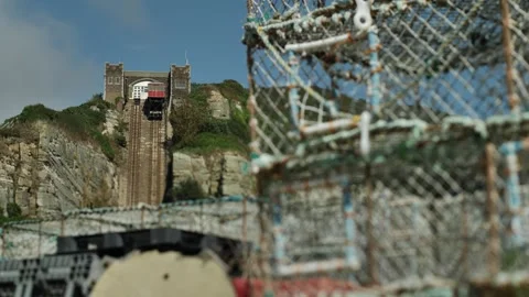 Hastings cliff top train and out of focus crab traps 4K Video stock 289208660