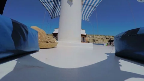 Hat and backpacks on deck of the yach Stock Footage 78499708