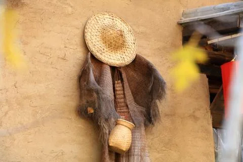 Hat and coir raincoat Stock Photos