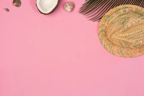 Hat and palm leaf isolated  on a pink background, top view Stock Photos