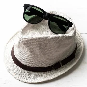 Hat and sunglasses Stock Photos