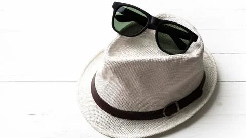 Hat and sunglasses Stock Photos