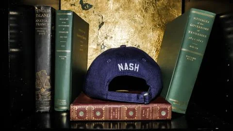Hat on a Bookshelf Stock Photos