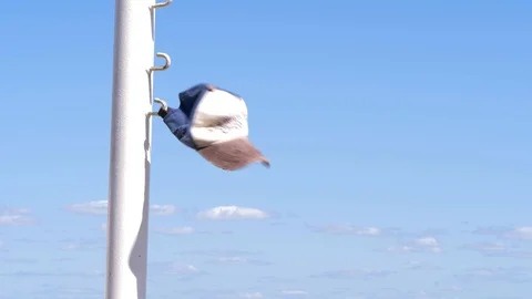 Hat fluttering in the wind in a pole in slow motion Stock Footage 120472924