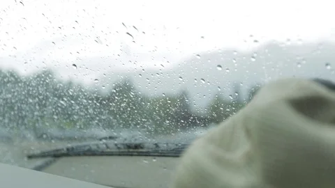 Hat inside a car with water on the windshield Video stock 90822513