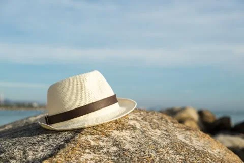 Hat on the rock at the beach Stock Photos