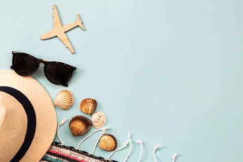 Hat, sunglasses, airplane,  shells, background for travel advertising Stock Photos