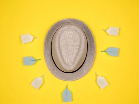 Hat surounded by paper planes Stock Photos