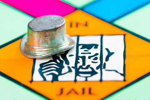 Hat token next to the JAIL in a Monopoly game Stock Photos