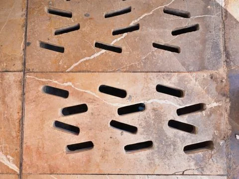 Hatch of ventilation shaft under marble floor. Stock Photos