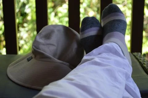 Hats off, feet up Stock Photos