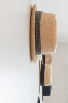 Hats hanging on wall Stock Photos