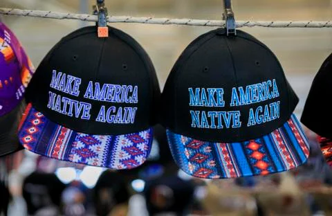 Hats with Native American pattern and Make America Native Again slogan for sa Stock Photos